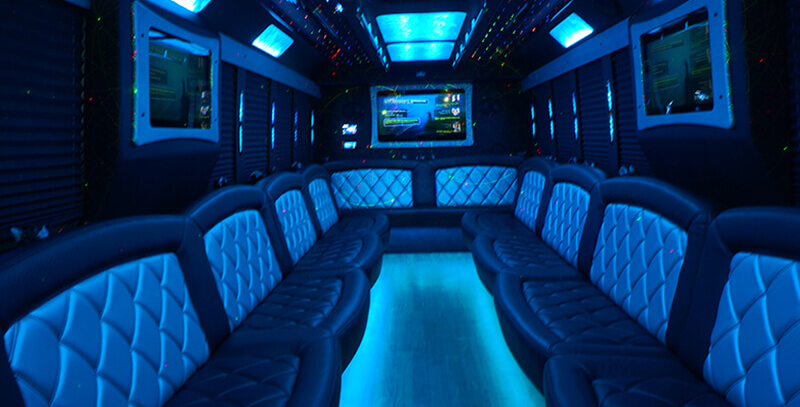 Inside a party bus with blue lighting